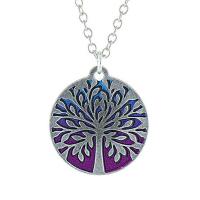 Silver Tree of Life necklace with vibrant magenta background