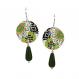 Close-up of Japanese floral earrings with large white flowers, green and red details, and a bold black patterned background.